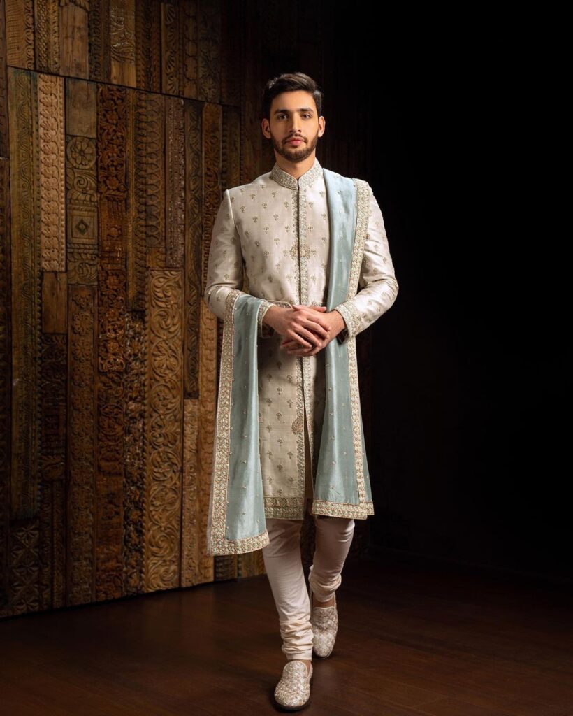 Designer Sherwani with light blue stole.